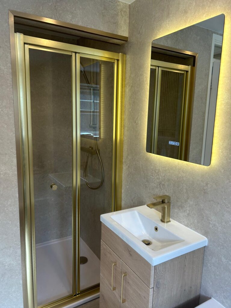 Brushed brass bifols shower and torro oak vanity unit